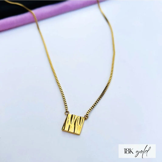 The Ella Gold plated square pendant has  a unique wave texture that reflects the light for a beautiful shine.