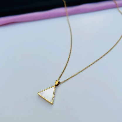 you can see how the white shell catches the light for a stunning effect on our Amelia triangle necklace